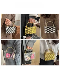 Chic acrylic box clutches in gold, silver, and clear styles with spiral ring handles