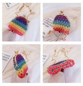 Detail view of colorful acrylic beaded mini bag with gold clasp and chain strap