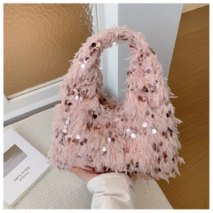 Close-up of pink fluffy bucket bag with sequins and elegant faux fur texture detail