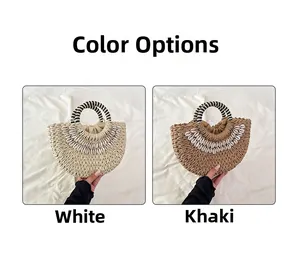 Detail view of woven straw handbags in white and khaki with shell accents and striped handles