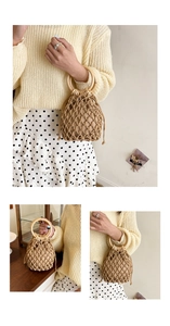 Close-up of woven bucket bag featuring wooden handles and a canvas drawstring liner