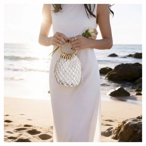 Detail of white crochet beach bucket bag with round wooden handles and cotton lining