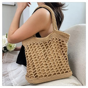 Close-up of hand-woven cotton rope tote bag with large mesh design and fabric lining