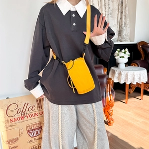 Model wearing a yellow mini crossbody bag showing size and casual style on the body