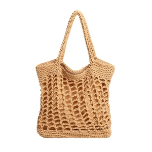 Detail of hand-woven cotton rope tote bag showing hollow mesh pattern and zipper lining