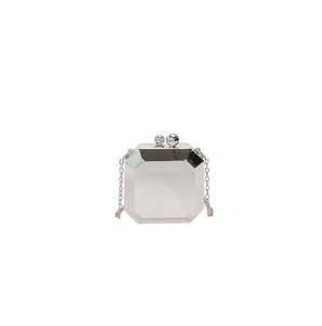 Detail of silver acrylic mirror octagon clutch bag with metal chain strap and ball clasp