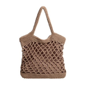 Detail of hand-woven cotton rope mesh tote bag with high-quality interior fabric lining