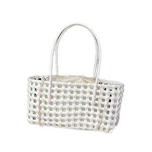 White hand-woven basket tote bag with drawstring inner pouch and slim handles