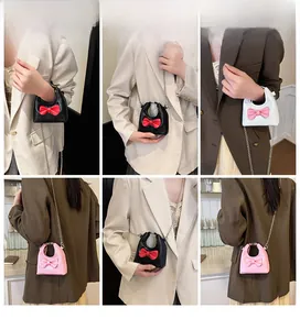 Mini candy-colored bow shoulder bags for girls shown from multiple angles on a model