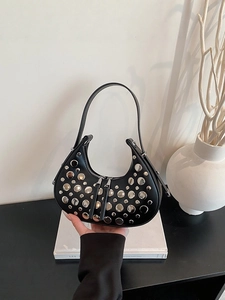 Black leather hobo bag with silver studs and sleek single handle for modern women