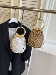 Handmade woven cotton rope beach bag with round wooden handles in white and khaki colors