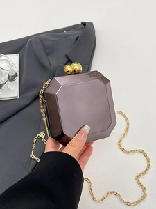 Luxurious octagonal metallic evening box bag with golden chain strap and ball clasp
