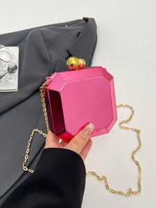 Fuchsia geometric acrylic mirror clutch bag with gold chain and ball clasp design