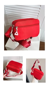 Nahaufnahme der roten Kinder-Gürteltasche aus Nylon mit mehreren Reißverschlüssen und Gurt