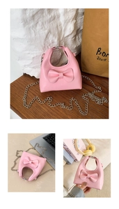 Detailed view of pink bow mini shoulder bag with hollow handle and silver metal chain