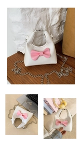 Mini white leather crossbody bag with pink bow and silver chain for young girls
