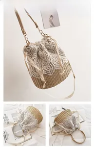 Detailed view of straw bucket bag featuring white lace stitching and drawstring closure