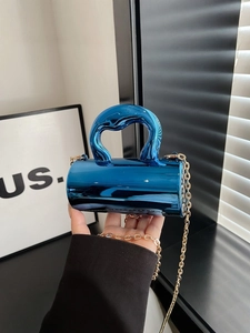 Blue metallic mini cylindrical handbag with top handle and gold chain strap