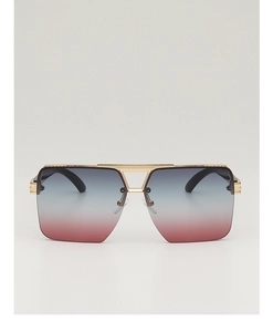 Detail of square oversized sunglasses with gold metal double bridge and gradient lenses