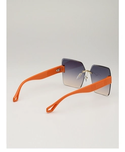 Detail of rimless diamond-cut sunglasses with gradient purple lenses and orange temples
