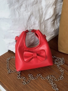 Red mini candy-colored kids crossbody bag with bow decoration and silver chain strap