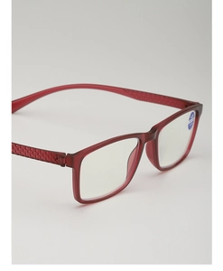Close-up of red resin reading glasses with anti-blue light lens and textured temples