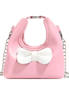 Pink candy-colored mini shoulder bag with white bow and silver chain for kids