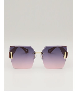 Detail of square oversized sunglasses with purple gradient lenses and gold metal accents