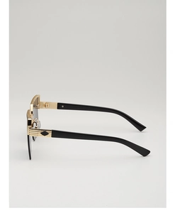 Detailed side view of golden metal frame sunglasses with black ergonomic temples