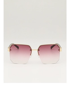 Detailed front view of oversized octagonal sunglasses with pink gradient lenses and gold trim