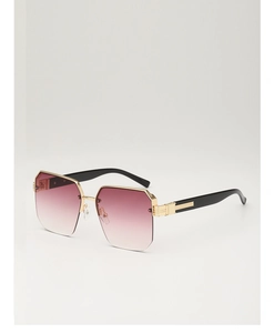 Detail of gold polygonal frames with purple gradient lenses and striped black temples