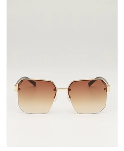 Detail of trendy polygonal metal sunglasses featuring gradient brown lenses and gold frame