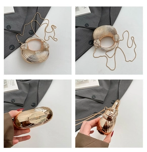 Detailed views of gold textured mini evening bag with round handle and chain strap