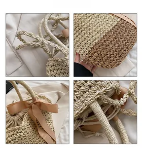Macro details of dual-tone straw tote bag featuring ribbon accent and rope handles