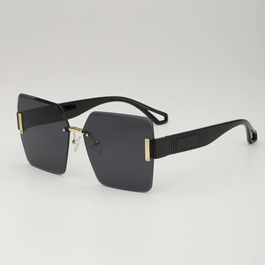 Frameless diamond cut oversized sunglasses with grey lenses and gold metal hinges
