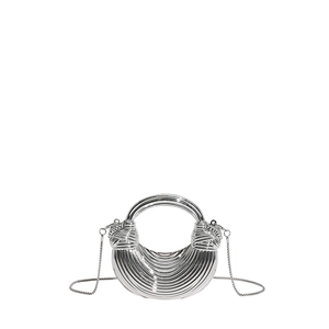 Detail of silver crescent acrylic evening bag with metallic pleats and round top handle