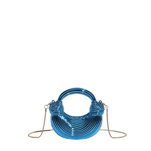Detailed close-up of electric blue metallic acrylic handbag with sleek gold chain strap