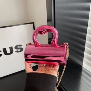 Elegant mini cylindrical handbag in metallic magenta with wide handle and gold chain strap