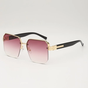 Modern oversized polygonal sunglasses with pink gradient lenses and gold metal accents