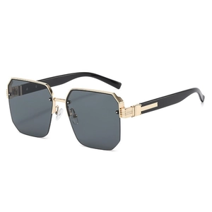 Fashionable oversized geometric sunglasses with gold metal frame and dark lenses