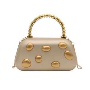 Elegant champagne gold hard shell evening clutch bag with pebble decor and ring handle