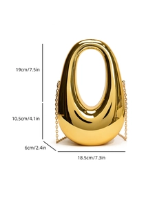 Detailed dimensions of a golden egg-shaped evening clutch bag with a sleek metal handle