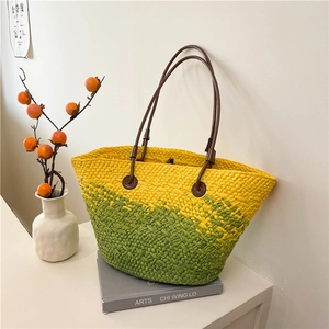 Summer woven tote bag in yellow and green gradient with brown leather handles