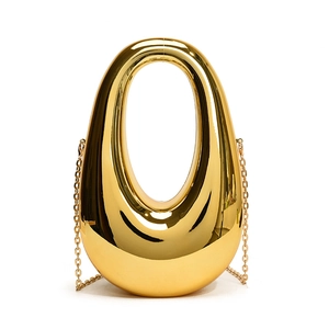 Golden acrylic box clutch featuring a modern drop-shaped cutout design with chain strap