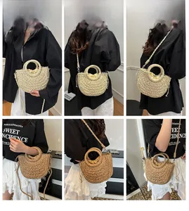 Detail of woven straw handbag featuring drawstring closure and versatile shoulder strap
