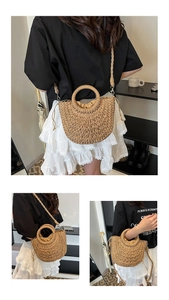 Detail of hand-woven straw beach bag with circular handles and drawstring inner lining
