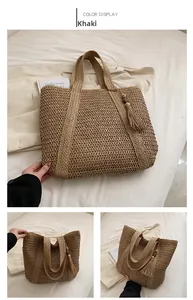 Close-up of khaki woven straw tote bag featuring a decorative wooden bead tassel charm