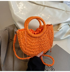 Detail of orange woven straw bag with ring handle and drawstring inner pouch
