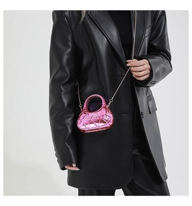 Metallic hot pink acrylic mini box bag with geometric texture and gold chain strap