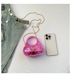 Pink acrylic box bag featuring geometric triangle texture and golden chain strap detail